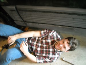 Getting out from under the car after the succesful repair. Getting out from under the car after the succesful repair.